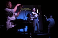 a group of people standing on a stage